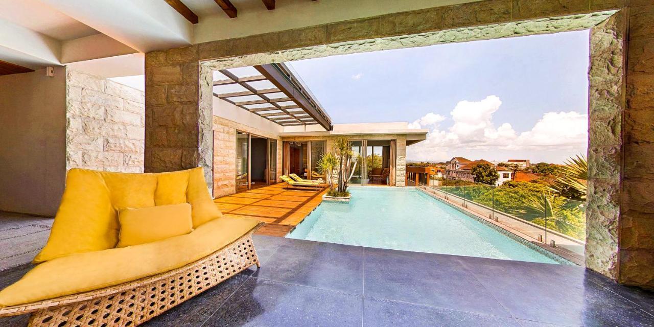 Ts Suites Seminyak Exterior foto Rooftop pool at the hotel